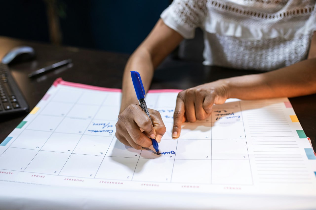 Marking dates on a calendar planner — tracking consistently over weeks matters