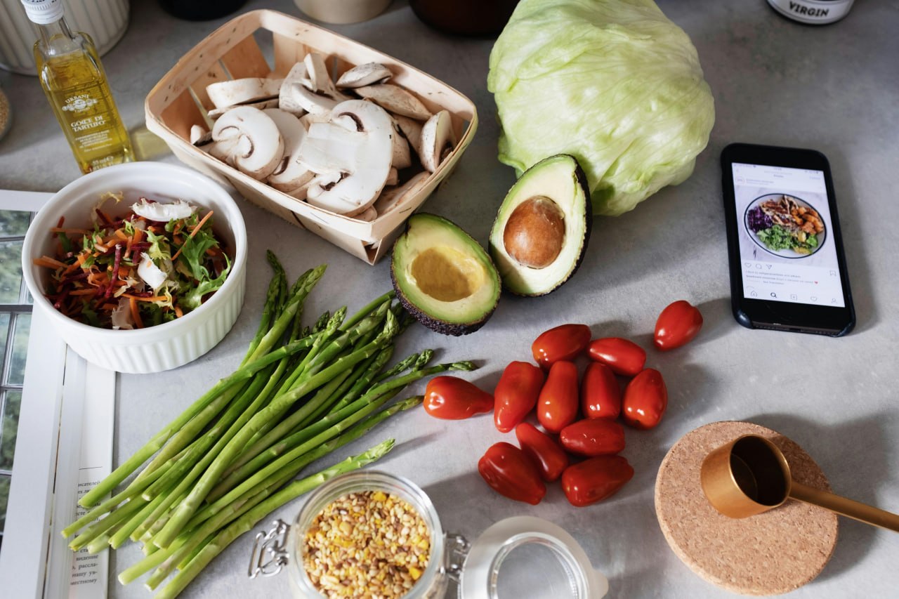 Fresh vegetables and ingredients laid out for meal prep during an elimination diet